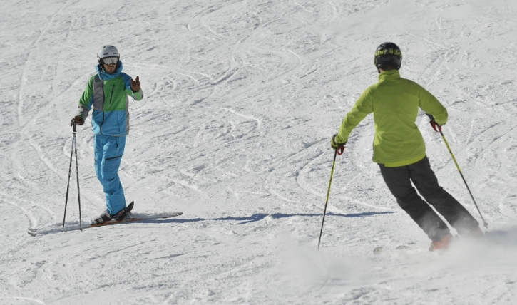 How do you initiate a parallel turn?